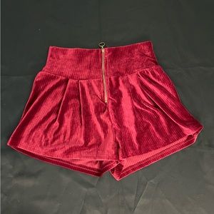 Maroon Shorts With a Zipper in the Front. Super soft and stretchy. Medium size.